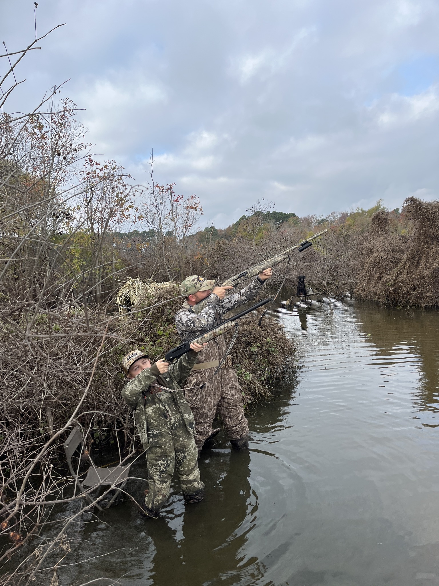 Hunters taking aim during duck hunt