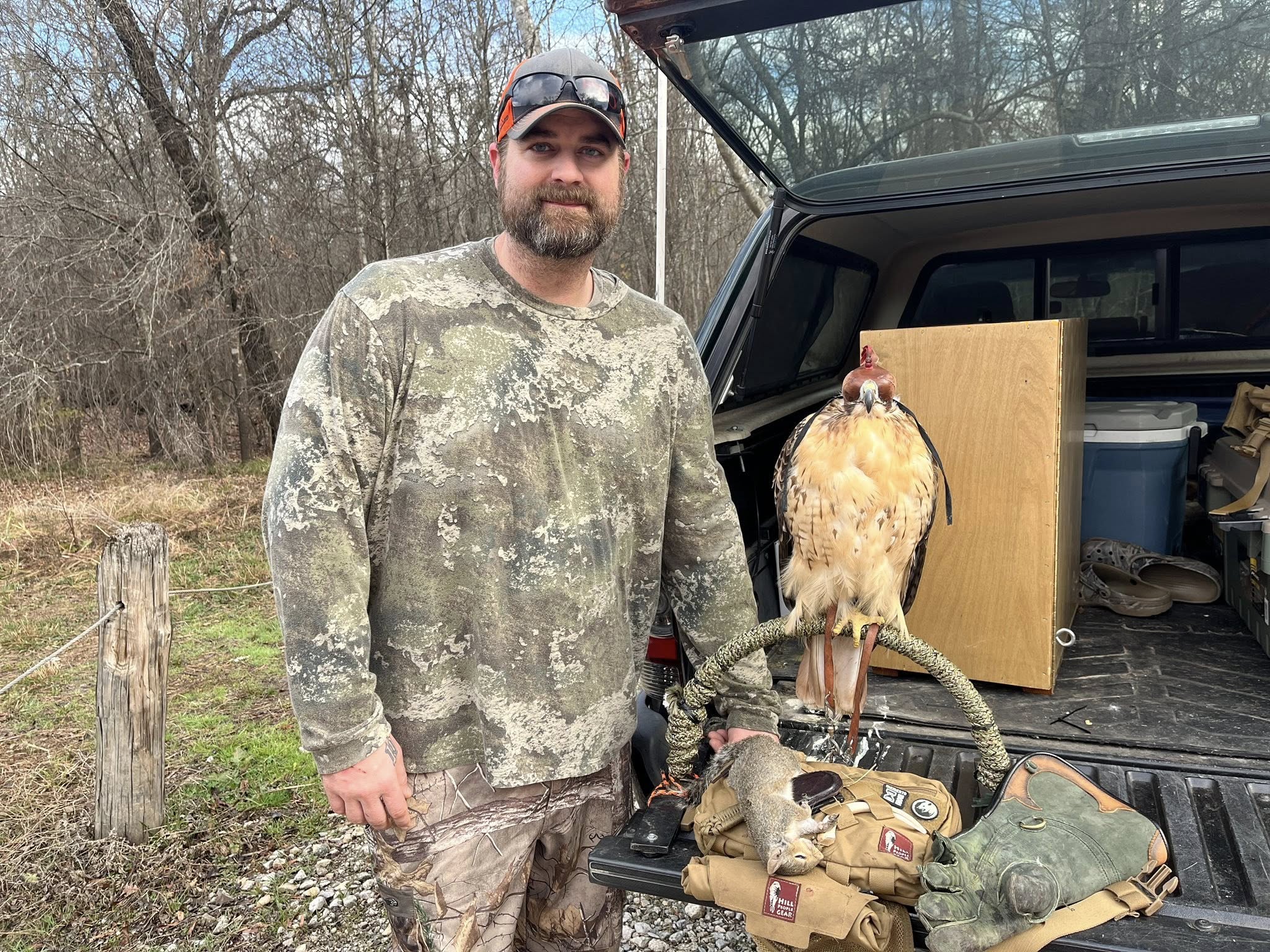 Veteran with a hawk during a falconry outing