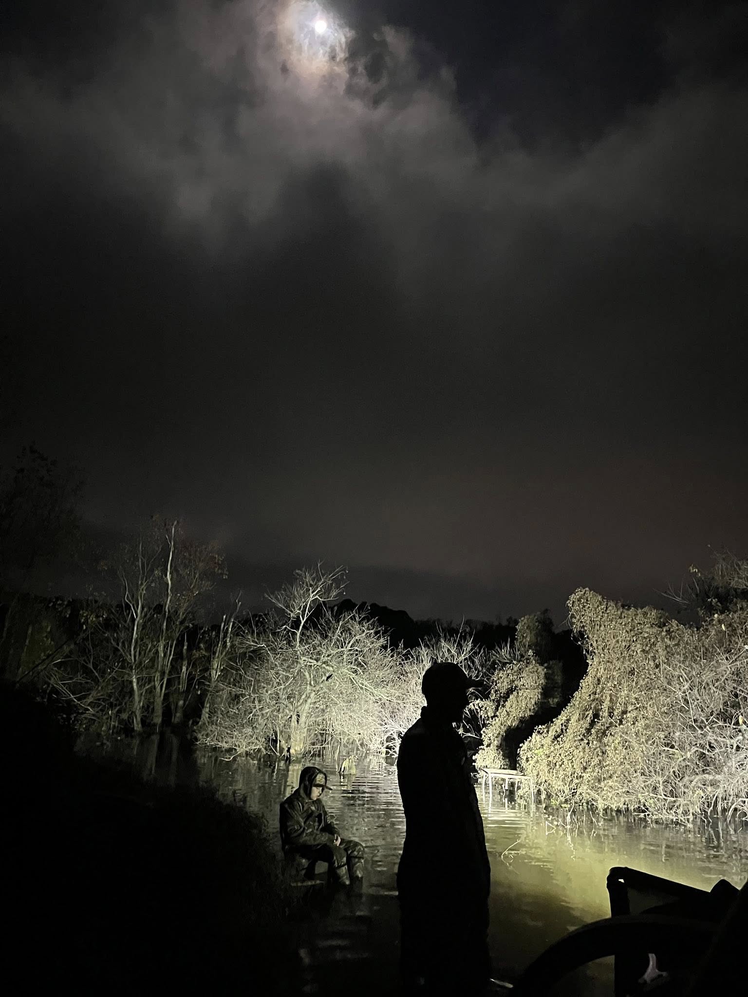 Night fishing under moonlight in East Texas
